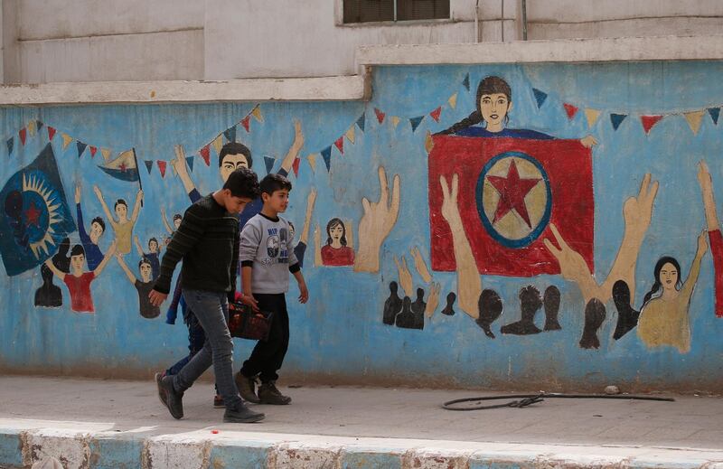 Syrian children carrying food walk in the northwestern city of Afrin, Syria, during a Turkish government-organised media tour into northern Syria, Saturday, March 24, 2018. Turkey and allied Syrian opposition fighters captured the city of Afrin on Sunday, March 18, nearly two months after the launch of an operation to clear the area of the main Syrian Kurdish militia known as the People's Protection Units or YPG. Turkey considers the YPG a terror group and an extension of Kurdish rebels waging an insurgency within its own borders.(AP Photo/Lefteris Pitarakis)