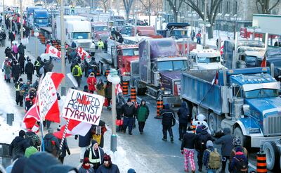 Lorries sit parked on Wellington Street near the Canadian Parliament in Ottawa as drivers and their supporters take part in a protest against cross-border vaccine mandates. Reuters