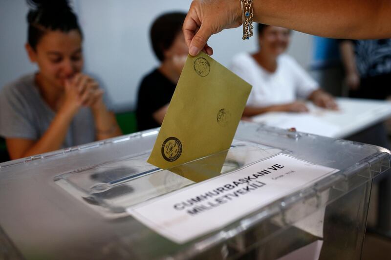 A woman casts her ballot at a polling station in Ankara, Turkey, on June 24, 2018. Burhan Ozbilici / AP Photo