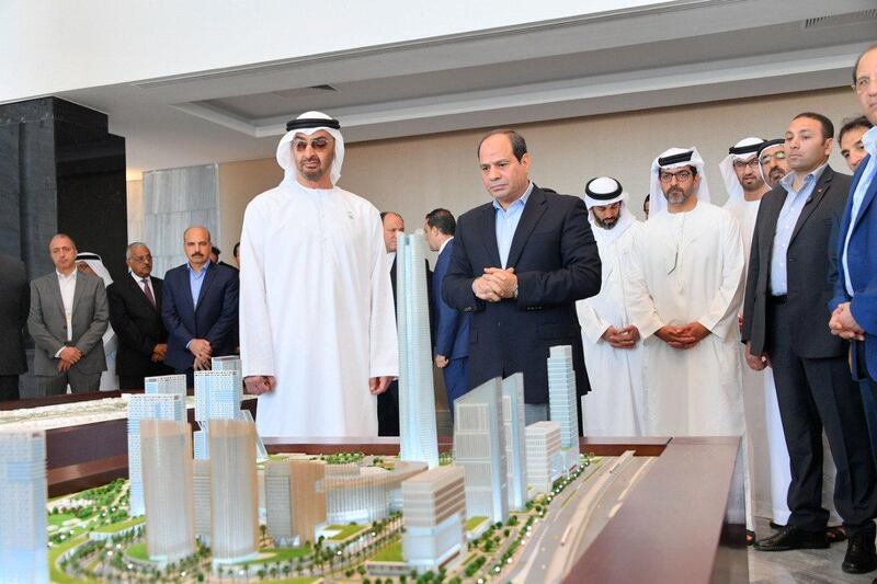 Crown Prince of Abu Dhabi and Deputy Supreme Commander of the UAE Armed Forces Sheikh Mohamed bin Zayed views plans for Egypt’s under construction resort city of New Alamein during a tour with President Abdel Fattah El Sisi on March 28, 2019. Egyptian Presidency HO