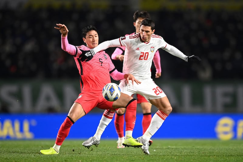 South Korea's Jung Woo-young, left, and UAE's Sebastian Tagliabue fight for the ball during their World Cup 2022 qualifier in Goyang on Thursday, November 11, 2021. AFP