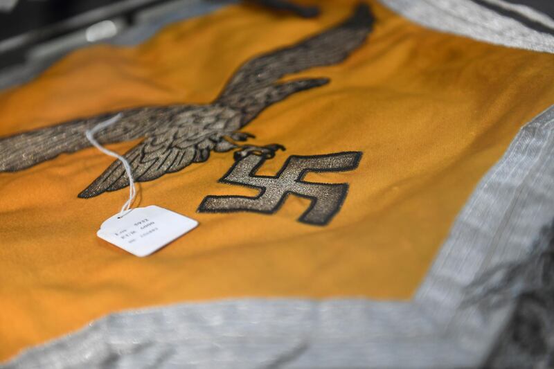 A Nazi flag with an eagle and a swastika is one of several hundred Nazi objects that went up for auction. Reuters