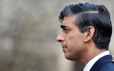 FILE PHOTO: Britain's Chancellor of the Exchequer Rishi Sunak takes part in an outside broadcast interview, in London, Britain, November 26, 2020. REUTERS/Toby Melville/File Photo