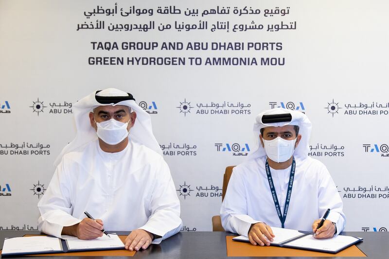Jasim Thabet, group chief executive and managing director at Taqa, left, with Captain Mohamed Al Shamisi, group chief executive of Abu Dhabi Ports at the signing of the agreement. Image courtesy of Taqa