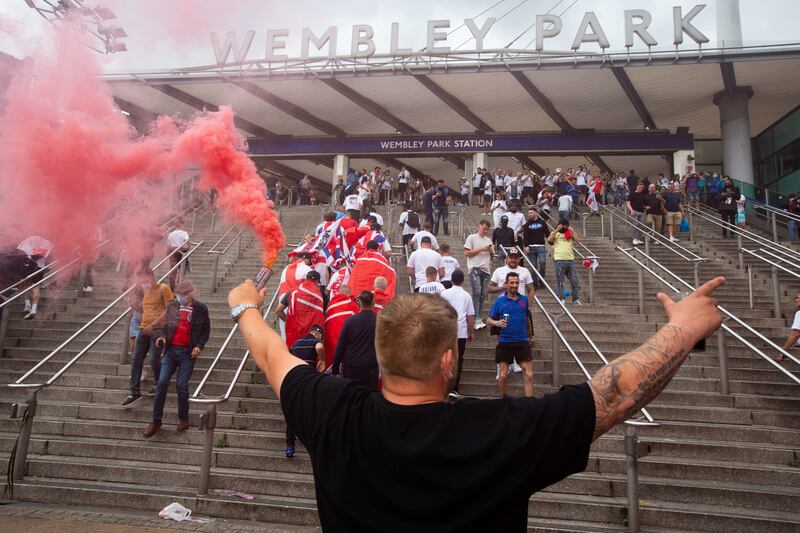 Fans arrive at Wembley stadium ahead of the Euros football final between England and Italy.