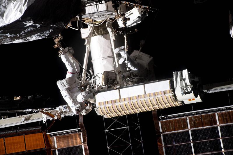 French astronaut Thomas Pesquet, left, of the European Space Agency is attached to a foot restraint while installing new solar panels on the International Space Station, with US astronaut Shane Kimbrough. AFP