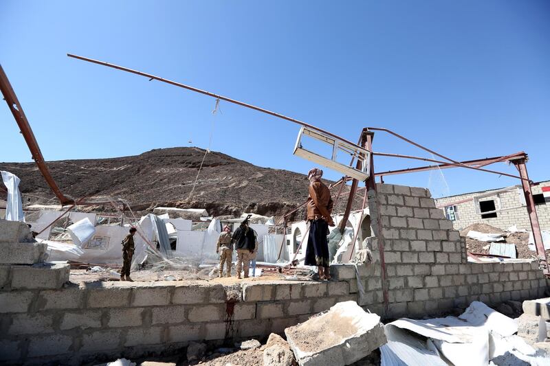 Government soldiers and other people inspect the site of a Houthi missile attack on a military camp’s mosque in Marib, Yemen January 20, 2020. REUTERS/Ali Owidha