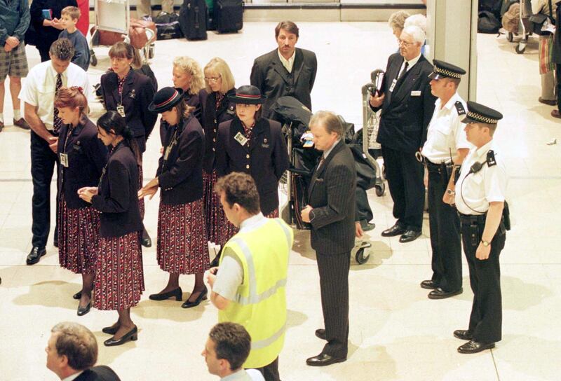 Passengers and staff observe a silence in Heathrow's Terminal One to mark the beginning of the funeral of Diana, Princess of Wales, in 1997