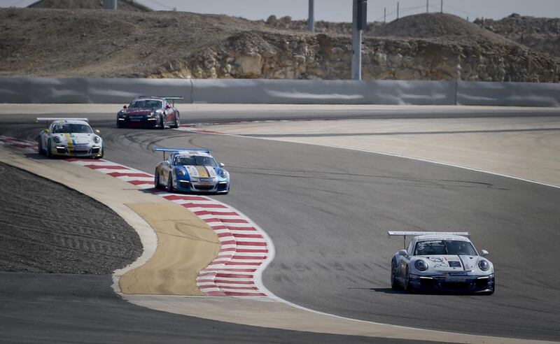 Zaid Ashkanani came in the front at Manama, Bahrain, followed in by Clemens Schmid and the rest of the pack in the penultimate race of the Porsche GT3 Cup Challenge Middle East. Courtesy Jorge Ferrari / March 7, 2014

