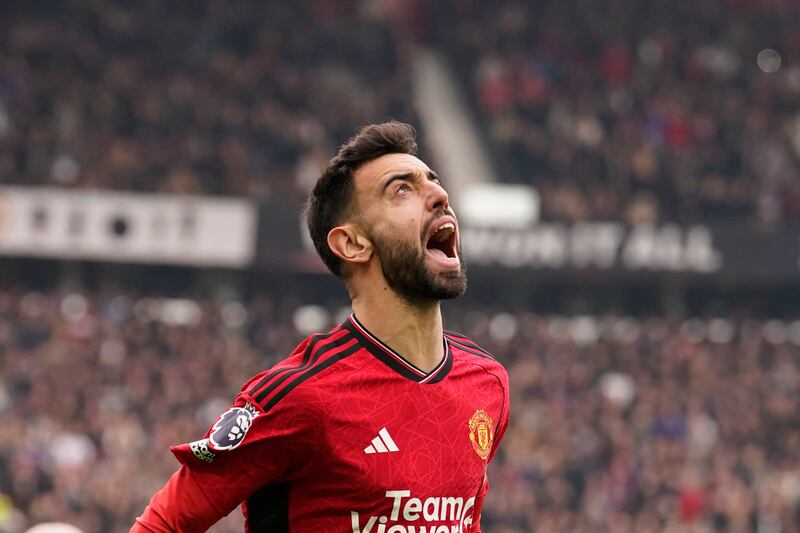 Manchester United's Bruno Fernandes celebrates after scoring the opening goal with a penalty kick. AP