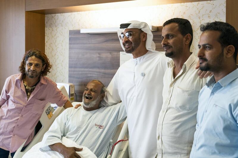 ABU DHABI, UNITED ARAB EMIRATES -  March 11, 2018: HH Sheikh Mohamed bin Zayed Al Nahyan, Crown Prince of Abu Dhabi and Deputy Supreme Commander of the UAE Armed Forces (3rd L), visits Fadel Mahmoud Saleh (2nd L), who is in Abu Dhabi receiving medical assistance at Burjeel Hospital. 
( Ryan Carter for the Crown Prince Court - Abu Dhabi )
---