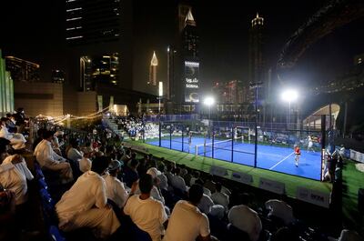 Spectators watch a padel tournament as part of the Dubai Padel Cup 2021, held on a purpose-built court at Jumeirah Emirates Towers, with the Museum of the Future as a backdrop. Photo: Dubai Padel Cup