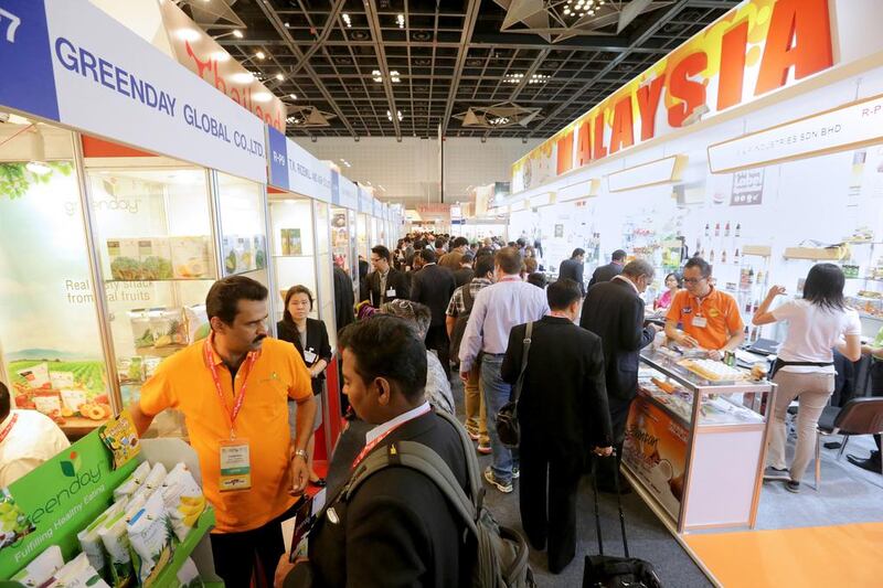 Participants fill the Thailand, left, and Malaysia showrooms at the Gulfood exhibition. Jaime Puebla / The National