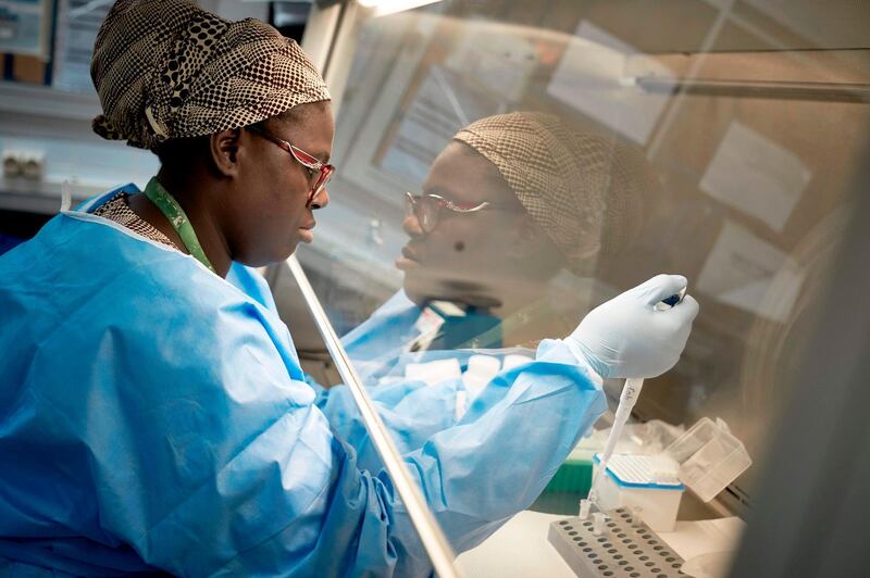 A Malian researcher conducts a coronavirus test, in the laboratory of the "Point G" hospital in Bamako. AFP