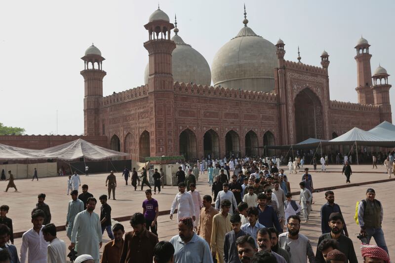 Muslims leave after offering first Friday prayers at the Badshahi mosque. AP