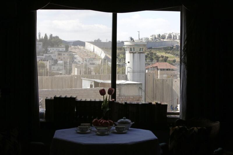 A view through a window from inside the Walled Off Hotel by British street artist Banksy. Abed Al Hashlamoun / EPA