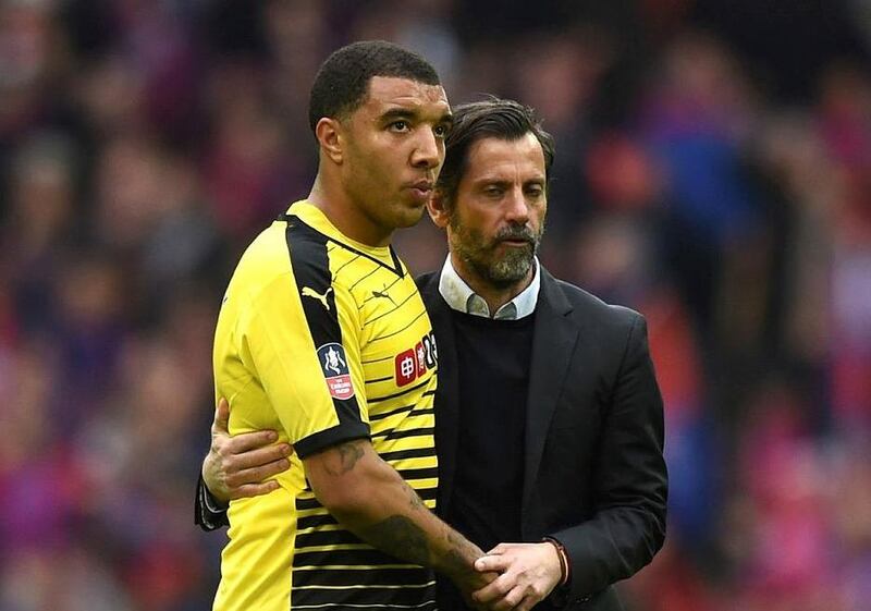 Watford striker Troy Deeney is consoled by his manager Quique Sanchez Flores after the 2-1 FA Cup semi-final defeat to Crystal Palace. Tony O'Brien / Reuters