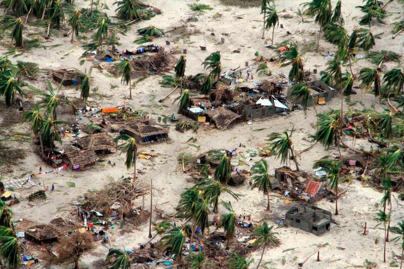 In this photo provided by the United Nations Office for the Coordination of Humanitarian Affairs (OCHA), badly damaged communities are seen from an aerial view, in Macomia district, Mozambique, Authorities have urged many residents to seek higher ground in the wake of Cyclone Kenneth as rain lashes the region. AP