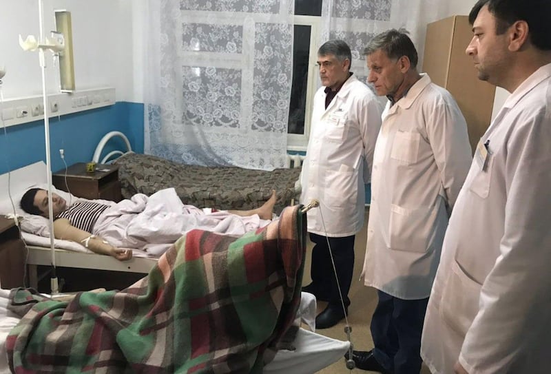 epa06540745 Doctors examine the wounded man in the hospital after shooting near the church in Kizlyar Dagestan, Russia, 18 February 2018. According to reports, five people were killed in the shooting that occurred outside a church in the town of Kizlyar.  EPA/STR