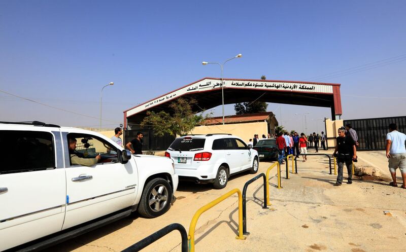 epa07094843 Vehicles cross from Jordan to Syria through the Jaber-Nassib border crossing after it was reopened between Syria and Jordan, 15 October 2018. The Nassib-Jaber border crossing between Syria and Jordan was reopened on 15 October for commercial traffic after three years of inactivity, as the Syrian side of the border was controlled by militants up until July, according to the state-run Syrian and Jordanian news services.  EPA/STRINGER
