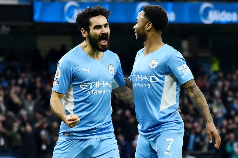 City's Ilkay Gundogan celebrates with with Raheem Sterling after scoring. Reuters
