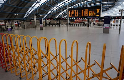 A barrier closes access to platforms at Waterloo Station in London. EPA