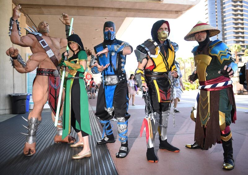 Cosplayers portray characters from "Mortal Kombat". AFP