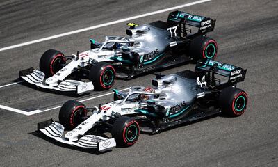 HOCKENHEIM, GERMANY - JULY 27: Lewis Hamilton of Great Britain driving the (44) Mercedes AMG Petronas F1 Team Mercedes W10 and Valtteri Bottas driving the (77) Mercedes AMG Petronas F1 Team Mercedes W10 stop in parc ferme during qualifying for the F1 Grand Prix of Germany at Hockenheimring on July 27, 2019 in Hockenheim, Germany. (Photo by Lars Baron/Getty Images)