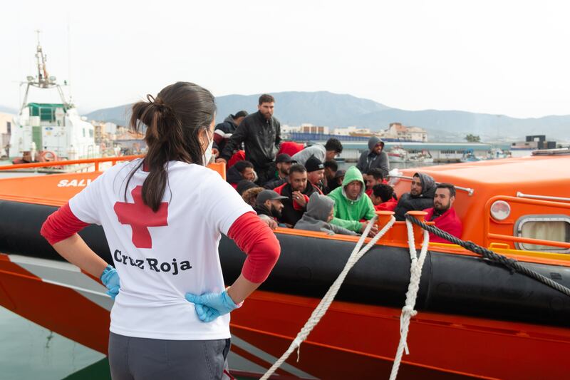 Red Cross members take care of migrants rescued by Spanish Salvamento Maritimo on their arrival at Motril in Granada, Andalusia, Spain, on April 26, 2022. EPA