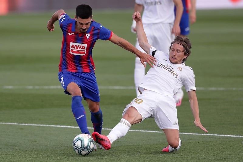 Segio Alvarez of Eibar is challenged by Real's Luka Modric. Getty