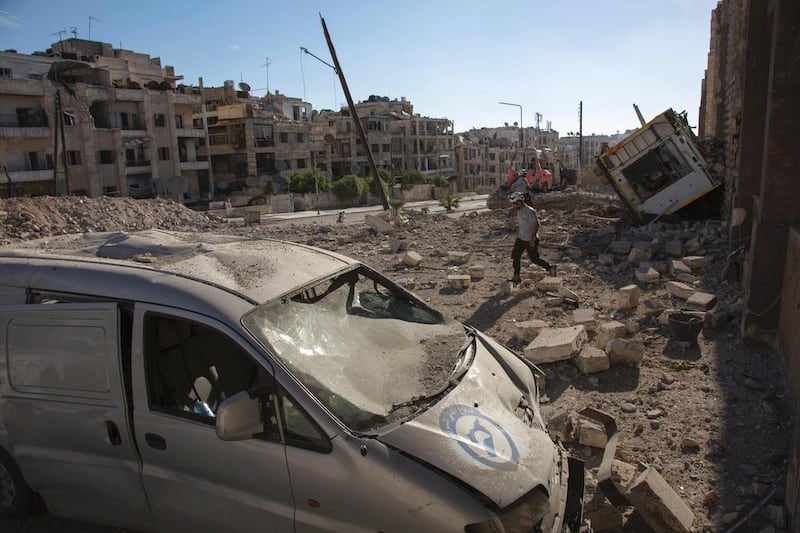 Rubble covers the rebel-held Ansari district of Aleppo, Syria after an air raid on September 23, 2016. Syrian and Russian aircraft pounded the area, a monitor said, after the army announced a new offensive aimed at retaking all of the divided Syrian city. Karam Al MasrI / Agence France-Presse
