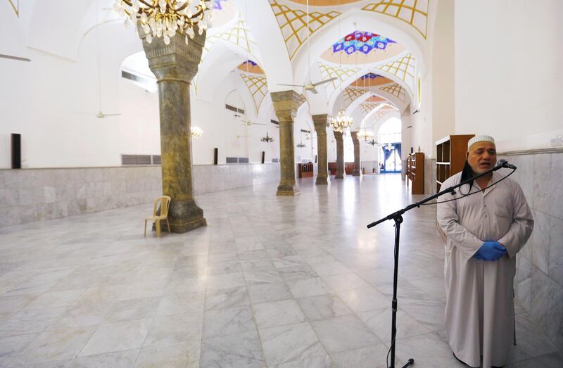 A muezzin at a mosque close to shrine of Sheikh Abdul Qadir Jeelani calls for prayer in Baghdad, Iraq. Reuters