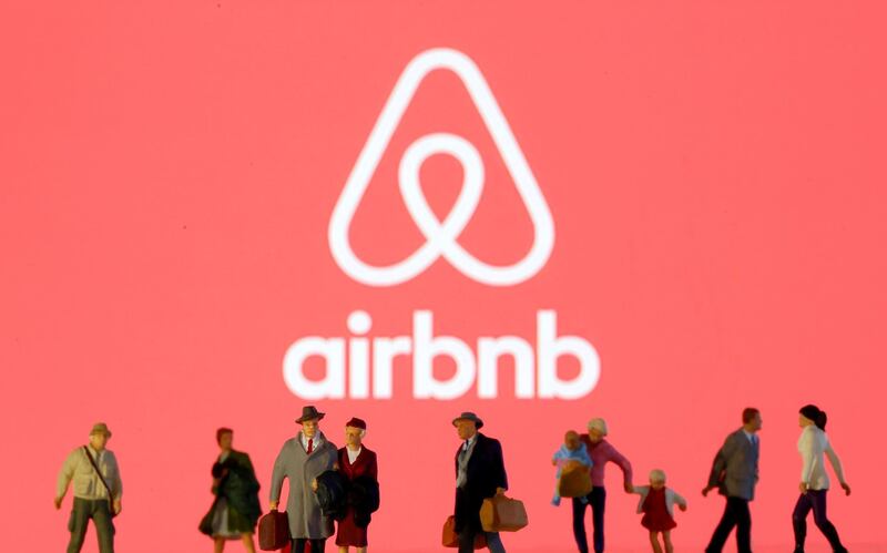 FILE PHOTO: Small toy figures are seen in front of diplayed Airbnb logo in this illustration taken March 19, 2020. REUTERS/Dado Ruvic/Illustration/File Photo