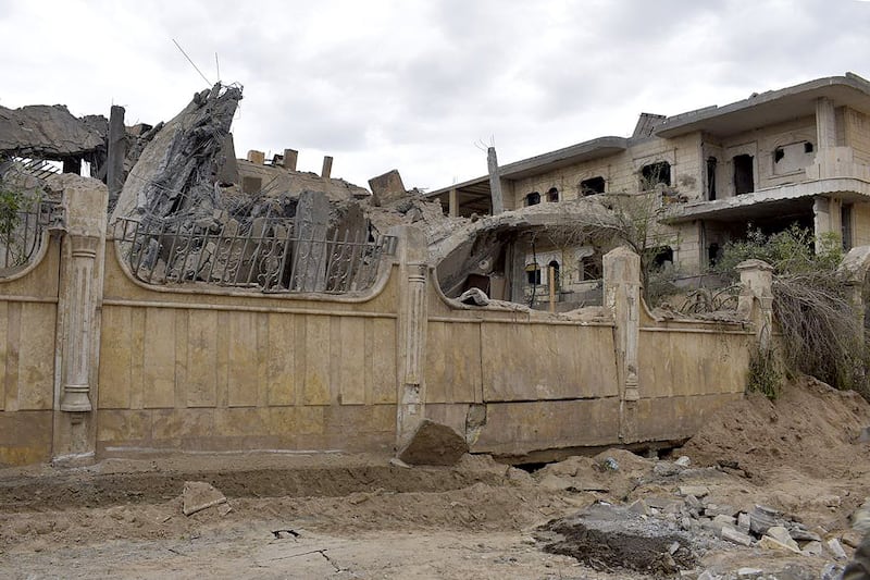 A building damaged in an air strike in Deir Ezzor, eastern Syria. the US has denied involvement in the attacks. AFP