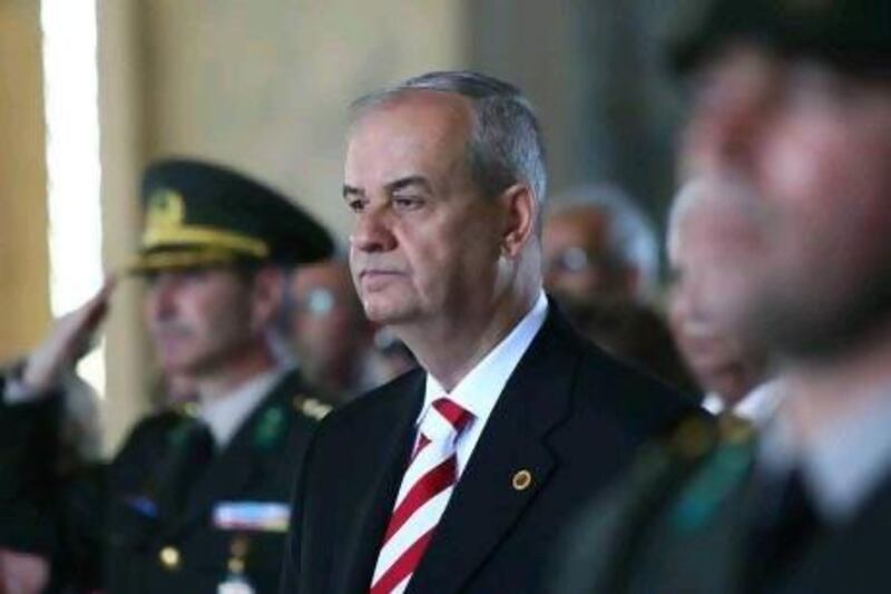 Turkey's then Chief of Staff General Ilker Basbug, centre, follows a guard of honour during a symbolic visit with his classmates who graduated from War College in 1962 to the mausoleum of Mustafa Kemal Ataturk, the founder of modern Turkey, in Ankara in 2010.
