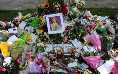Flowers, pictures and messages are left in tribute to late soul music and pop star Amy Winehouse, near the house in north London where her body was found the previous day, on July 24, 2011. Soon after the 27-year-old songstress's death was announced on July 23, fans started gathering in Camden Square, north London, to bid farewell to a star whose songs often reflected her tempestuous lifestyle. AFP PHOTO/CARL COURT