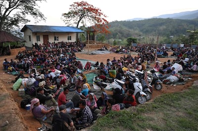People cram into at a temporary shelter at a military-run camp in Manipur, having fled their homes. AFP