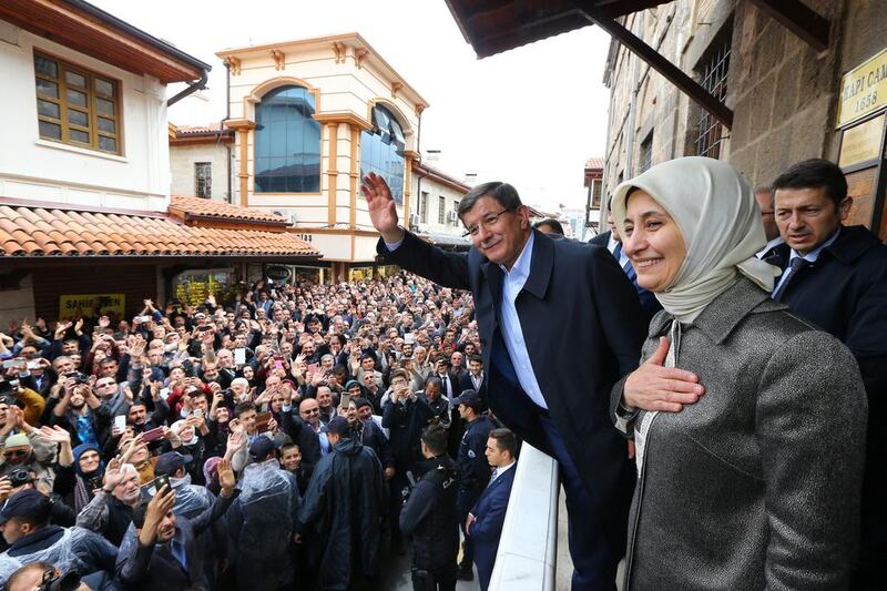 Outgoing Turkish prime minister Ahmet Davutoglu, accompanied by his wife Sare Davutoglu, greets supporters in the central Anatolian city of Konya. Hakan Goktepe / Prime Minister's Press Office