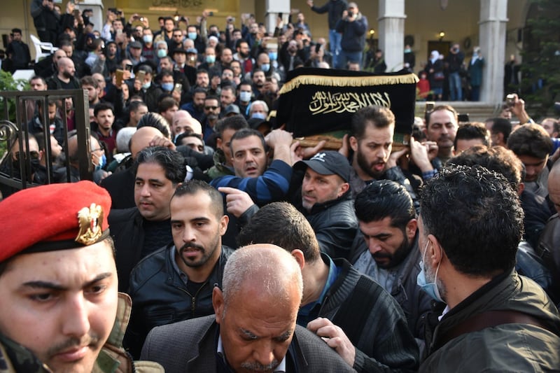 Mourners carry the coffin of Syrian actor and director Hatem Ali. EPA