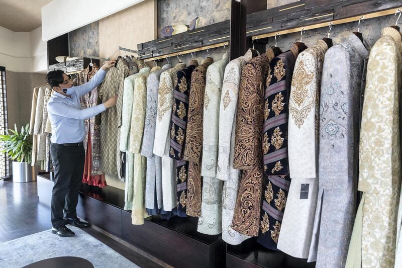 Eid Tailors. Tailors in Dubai are on the road to recovery as Eid outfit orders pick up this year compared to last year. Staff at Kachins in Bur Dubai do last minute work to get this years Eid outfit orders ready before the end of Ramadan tonight on May 10th, 2021. 
Antonie Robertson / The National.
Reporter: Kelly Clarke for National.