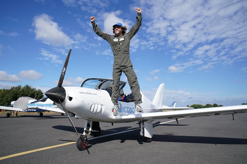 Mack Rutherford, 17, celebrates after arriving at Biggin Hill Airport in Kent on Monday, as he continues his bid to set a Guinness World Record as the youngest person to fly around the world solo in a small plane. PA