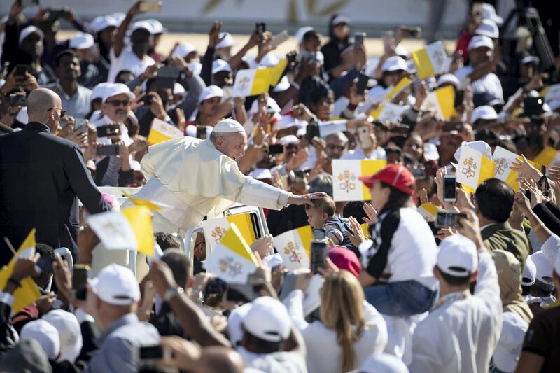 ABU DHABI, UNITED ARAB EMIRATES - February 05, 2019: Day three of the UAE papal visit - His Holiness Pope Francis, Head of the Catholic Church (in vehicle) greets crowds upon arrival at Zayed Sports City Stadium to celebrate mass.

( Ryan Carter / Ministry of Presidential Affairs )
---
