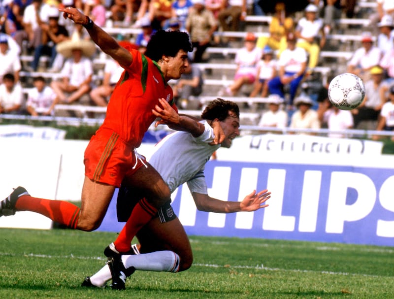 England's Bryan Robson (r) dislocates his shoulder in a challenge during the game against Morocco. Getty Images