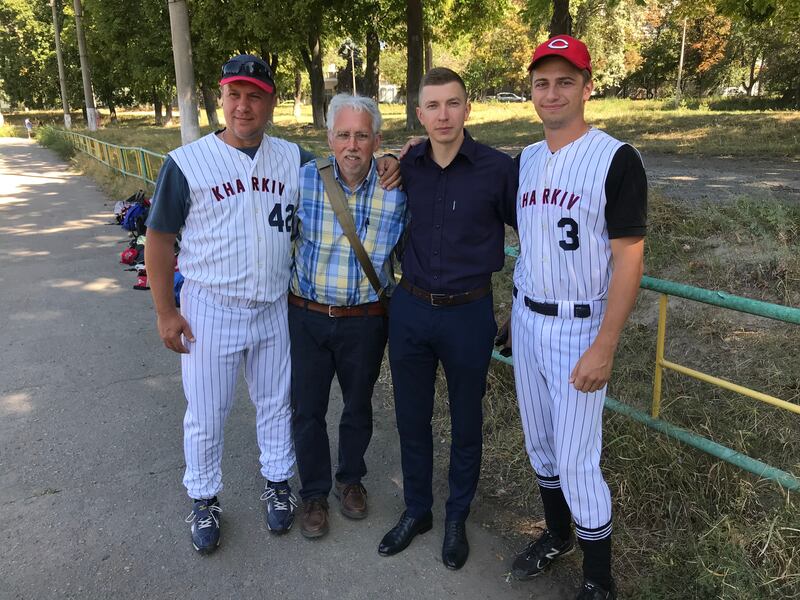 Bob Herring, second left, with friends in Kharkiv who have taken up baseball through the Sister Cities International partnership.