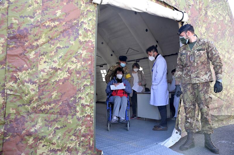 Italian healthcare personnel vaccinate patients against the coronavirus with the Pfizer-BioNTech inoculation in a centre established by army at Cecchignola in Rome, Italy. EPA