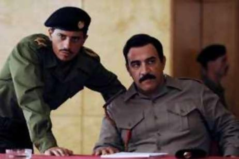 In this image released by HBO, Said Taghmaoui portrays Barzan Ibrahim, left, and Igal Naor portrays Saddam Hussein in a scene from the HBO miniseries, "House of Saddam," airing Sunday, Dec. 7 and Dec. 14 at 9 p.m. EDT on HBO. (AP Photo/HBO, Alan Keohane)