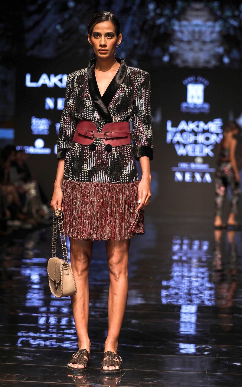 epa07783849 A model presents a creation by Indian designer Sonal Verma during the Lakme Fashion Week (LFW) Winter/Festive 2019 in Mumbai, India, 21 August 2019. More than 75 designers are showcasing their collections at the event until 25 August.  EPA/DIVYAKANT SOLANKI