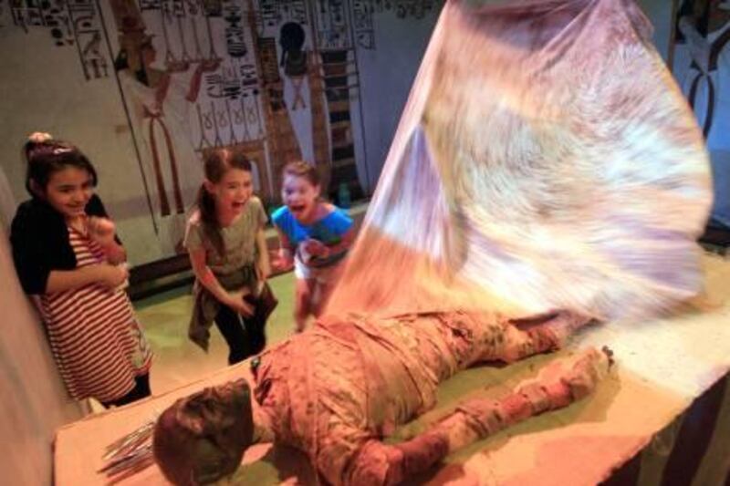 ABU DHABI - 18NOV2011 - School children react seeing a dummy mummy at the Abu Dhabi Science Festival yesterday at Abu Dhabi National Exhibition Centre. Ravindranath K / The National
