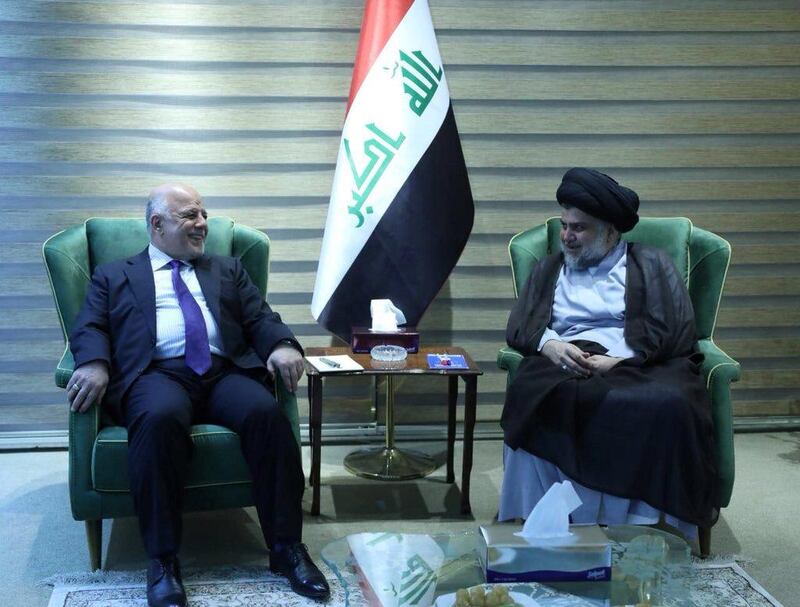 Iraqi Shi'ite cleric Moqtada al-Sadr meets with Iraqi Prime Minister Haider al-Abadi in Baghdad, Iraq May 20, 2018. Iraqi Prime Minister Media Office/Handout via REUTERS ATTENTION EDITORS - THIS IMAGE WAS PROVIDED BY A THIRD PARTY. NO RESALES. NO ARCHIVES