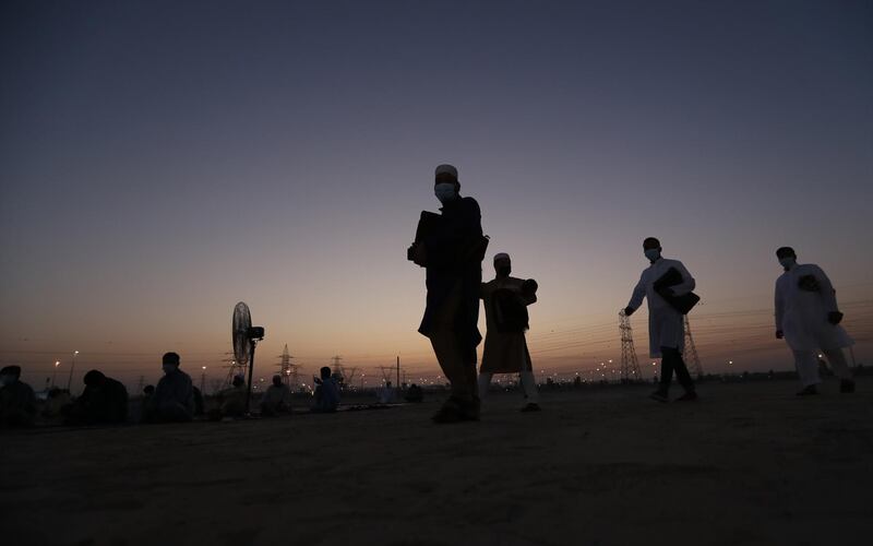 Muslims arrive at the prayer grounds at Nad Al Hammar in Dubai for Eid prayers. EPA